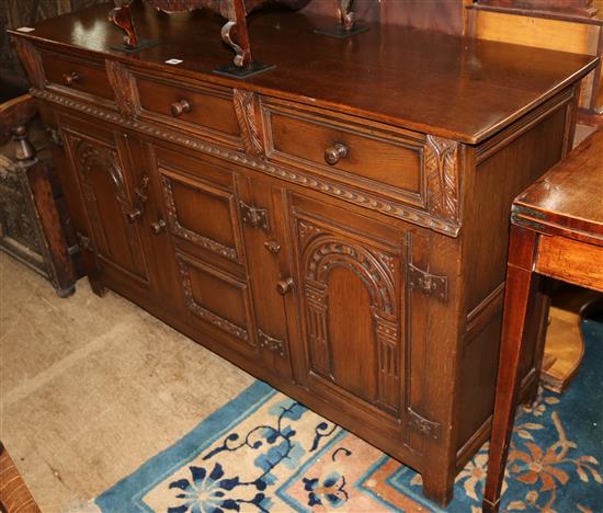 A Tudor style carved oak sideboard
